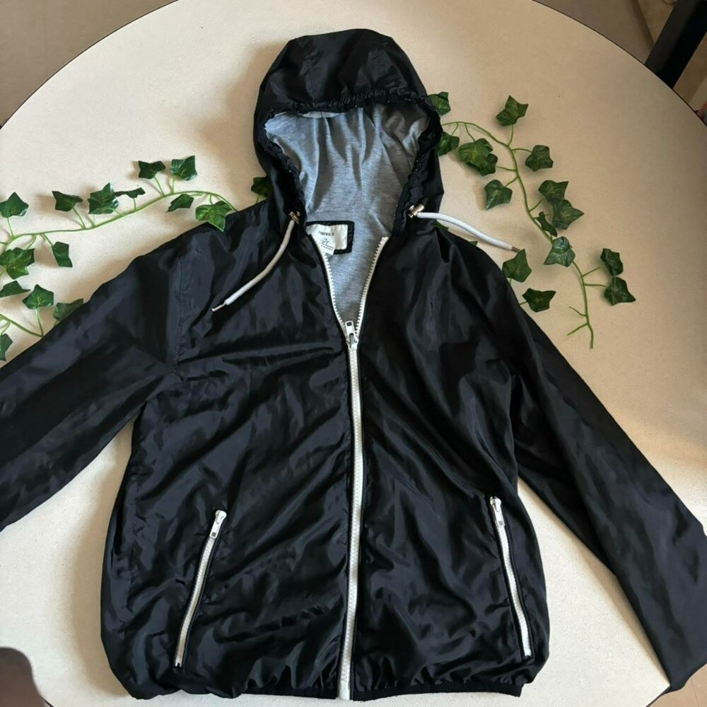 Black zip-up hooded windbreaker